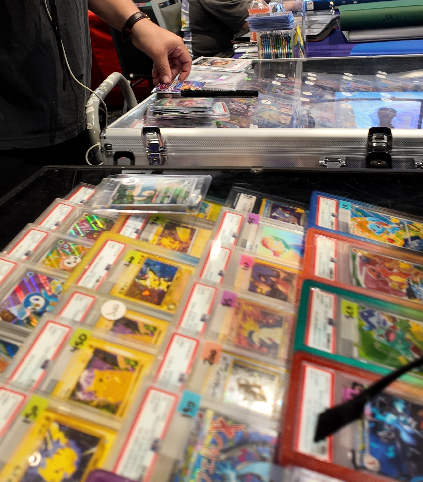 Collectors trading cards laid out across a table